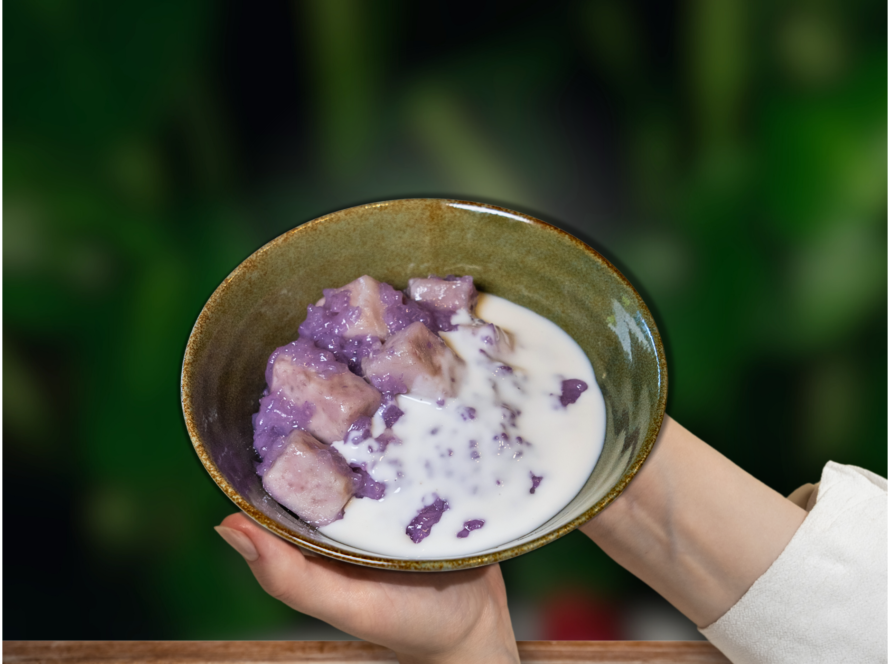 A bowl of creamy yogurt topped with vibrant purple fruit, set against a backdrop of Phu Quoc Paradise.