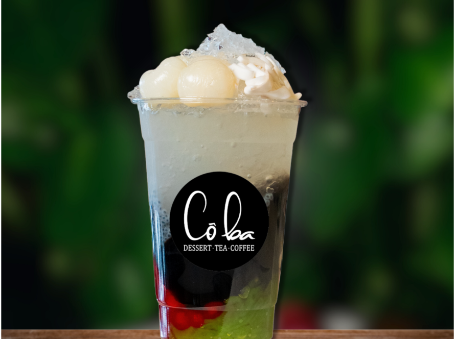 A refreshing drink topped with ice cream and colorful fruit, served at Sai Gon Pearl.